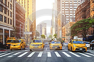 Yellow cabs on the streets of NYC during daytime