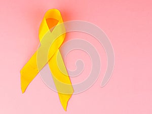 Yellow cancer awareness ribbon as symbol of childhood cancer awareness, Support the Troops Ribbon