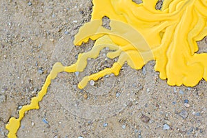 Yellow candle drippings on ground