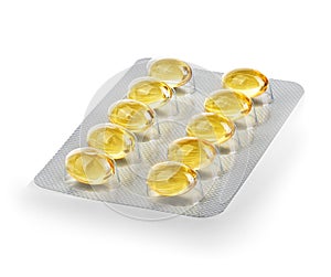 Yellow capsules in blister close-up isolated