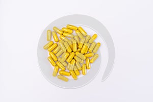 Yellow capsules on a white background