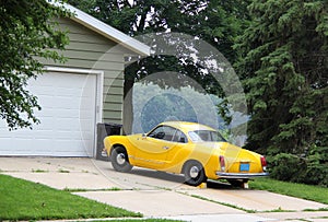 Yellow car on the driveway