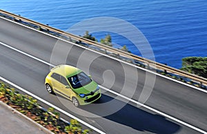 Yellow car moving on the road