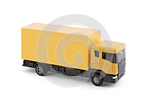 Yellow cargo delivery truck miniature isolated on white background