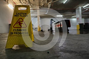 Yellow caution wet floor cleaning in progress warning sign