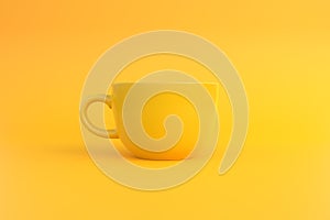 Yellow ceramic coffee cup on yellow background