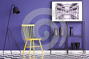 Yellow chair, black lamp, metal shelf, vases and painting set on