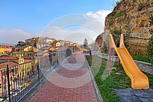 Children slide on playground in small town in Italy. photo