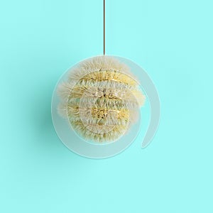 Yellow Christmas ornament on blue background