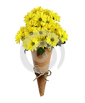 Yellow chrysanthemum flowers in a brown craft paper cornet isolated