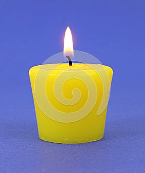 Yellow citronella candle