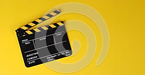 Yellow clapper board or movie slate on yellow background.