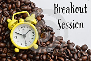 Yellow clock and coffee bean brown roasted with text BREAKOUT SESSION