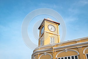 Yellow clock tower and building in Sino-Portuguese architectural style