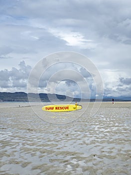 Yellow coast guard rescue surfboard at Narin Beach by Portnoo, County Donegal - Ireland