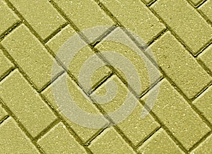 Yellow color cobblestone pavement close-up