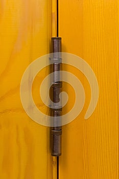 Yellow color door hinge metal object door detail element part close-up macro