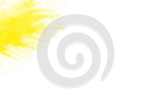 Yellow  color powder splatter on white background. Color particles splash