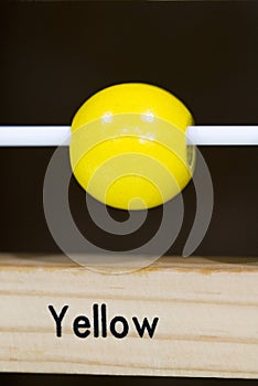 Yellow color Wooden toy to learn and play with shapes and color