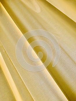 Yellow curtain texture and background. backlight.