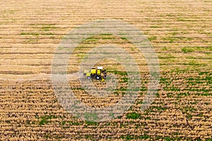 Yellow combines works in the field.