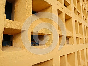 yellow concrete roster ventilation wall