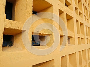 yellow concrete roster ventilation wall