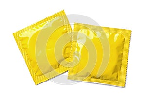 Yellow condom packages on white background, top view. Safe sex
