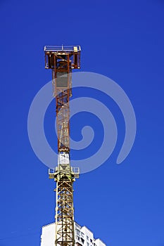 Yellow construction crane isolated