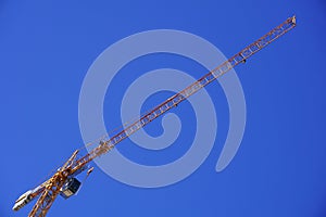 Yellow construction crane isolated