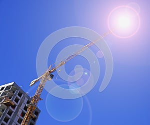 Yellow construction crane isolated