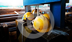 yellow construction helmets on work place