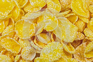 Yellow Cornflakes close up photo, Food texture background, top view. Macro shot. Perfect breakfast
