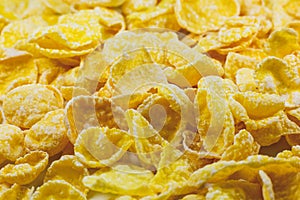 Yellow Cornflakes close up photo, Food texture background, top view. Macro shot. Perfect breakfast