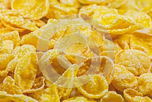 Yellow Cornflakes close up photo, Food texture background, top view. Macro shot. Perfect breakfast