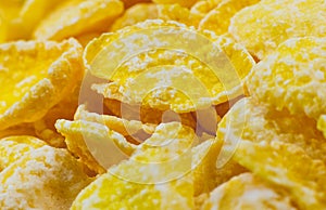 Yellow Cornflakes close up photo, Food texture background, top view. Macro shot. Perfect breakfast