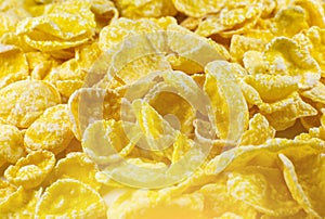 Yellow Cornflakes close up photo, Food texture background, top view. Macro shot. Perfect breakfast