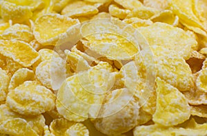 Yellow Cornflakes close up photo, Food texture background, top view. Macro shot. Perfect breakfast