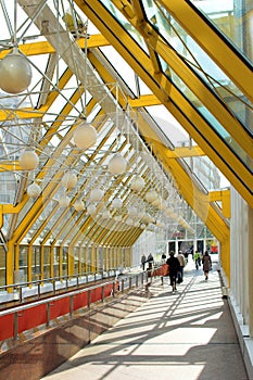 Yellow corridor windows and people