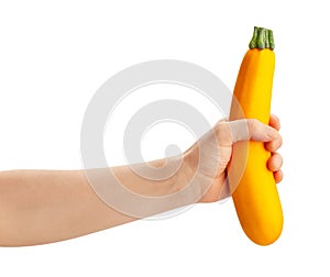 Yellow courgette in hand