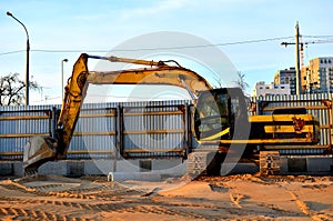 Yellow crawler Excavator on construction site