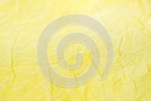Yellow creased paper tissue texture background