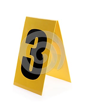 Yellow crime scene marker with number three on white background