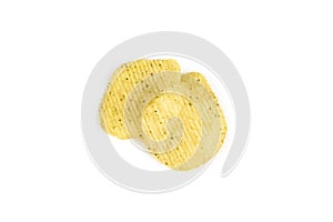 Yellow crispy ridged potato chips on white background