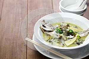 Yellow croaker fish soup with preserved snow vegetable