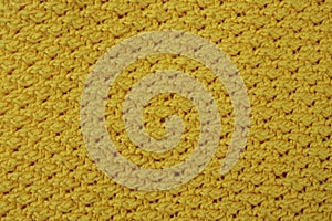 Yellow crochet pattern, close up texture