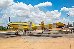 A yellow crop duster plane photo