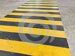 Yellow crosswalk. Yellow crosswalk painted lines close up