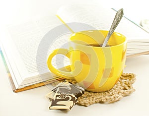 Yellow cup and book