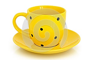 Yellow cup and saucer